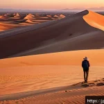 아랍어권에서의 사막 탐험 - A vast desert landscape at sunset, featuring a sweeping view of golden sand dunes under a dramatic s...